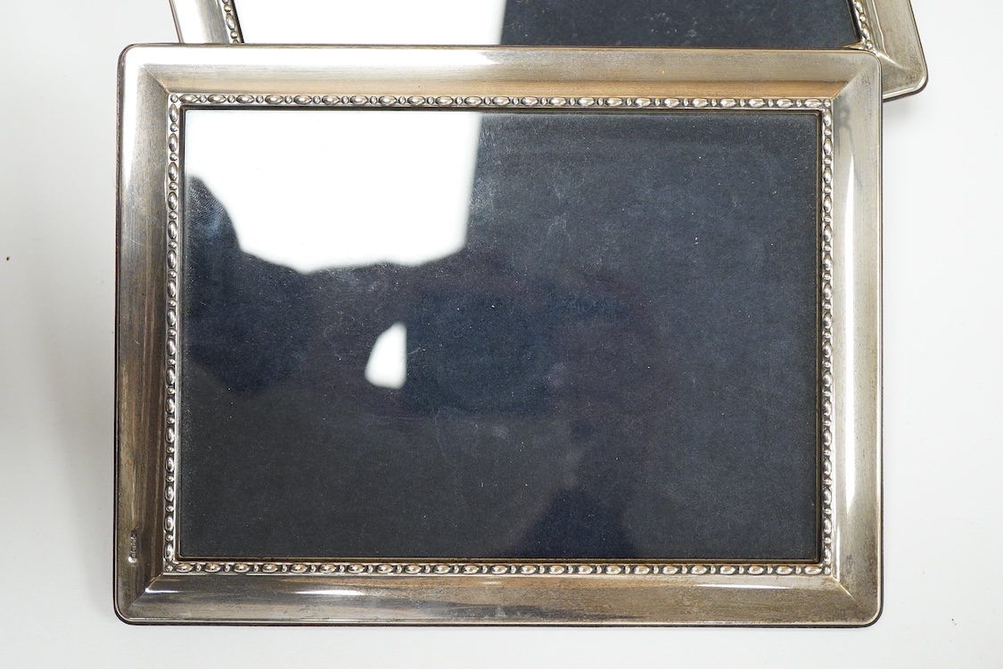 A pair of modern silver mounted photograph frames, 20.8cm and matching larger frame, 23.2cm, by Carr's of Sheffield, Ltd, Sheffield, 1996, together with one other modern silver mounted photograph frame and a similar Ital